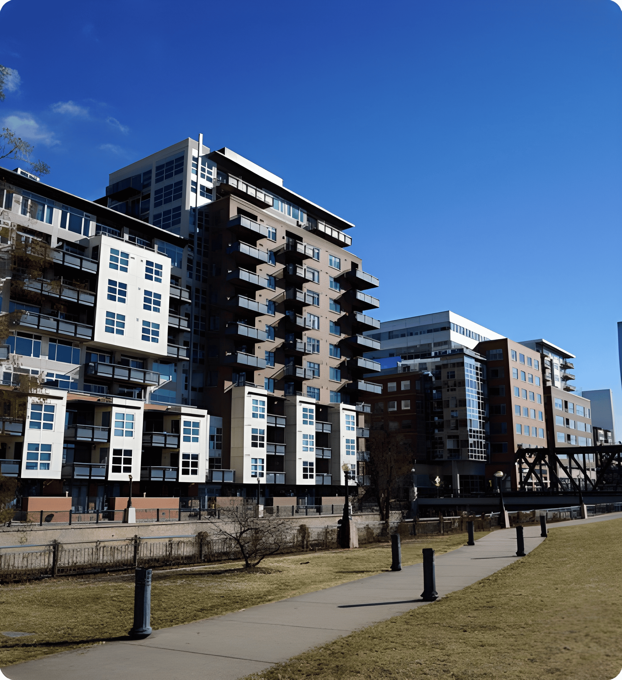 Modern apartment buildings under a clear sky.